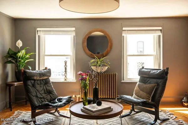 a living room with furniture and a window