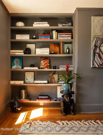 a room with books and a book shelf