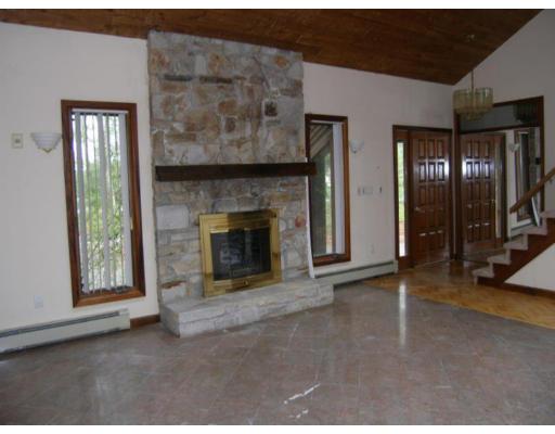 26 Perry Road Athol, MA 01331 - Photo 5 of 10 a view of empty room with fireplace and window