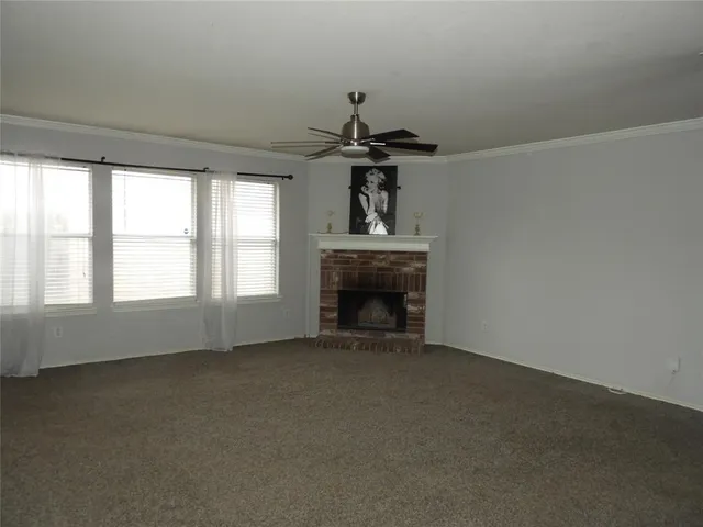 a view of empty room with fireplace