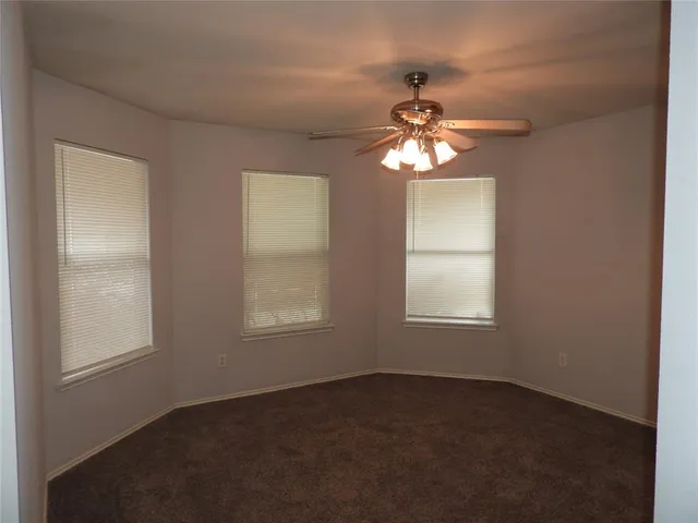 a view of a chandelier fan and a chandelier fan in a room