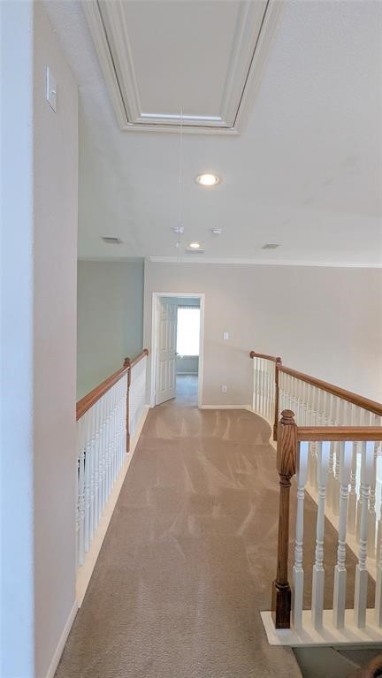 20909 Springport Court Katy, TX 77450 - Photo 24 of 39 Bright and airy upstairs hallway with elegant wood and white banisters leads to a cozy carpeted room, perfect for a peaceful retreat.