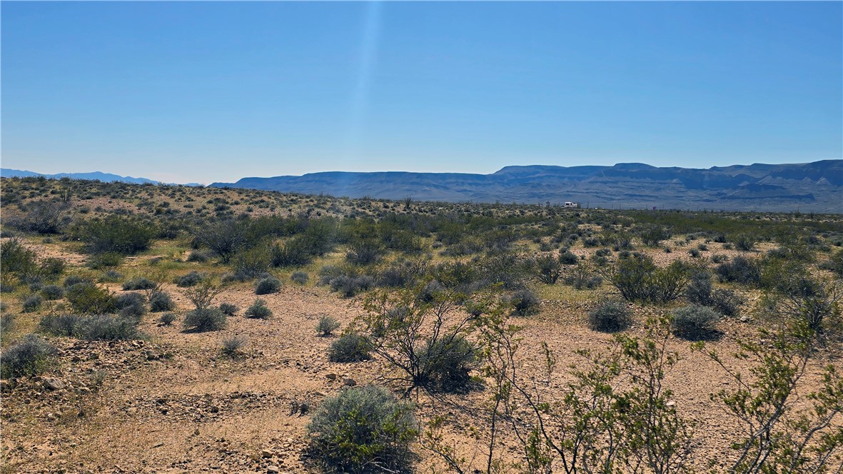 208-21-166 South Akchin Road Yucca, AZ 86438 - Photo 11 of 16 a view of an outdoor space with mountain view