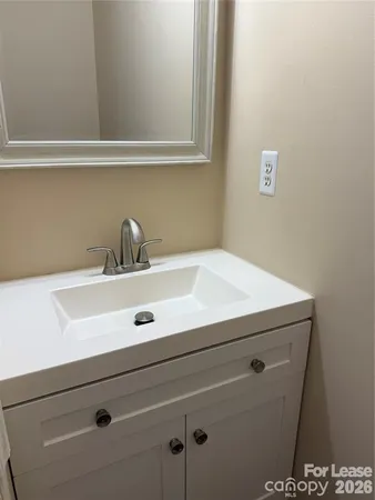 a close view of sink and cabinets