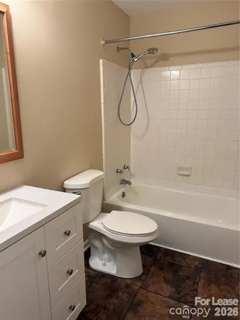 a bathroom with a sink a toilet and a bathtub