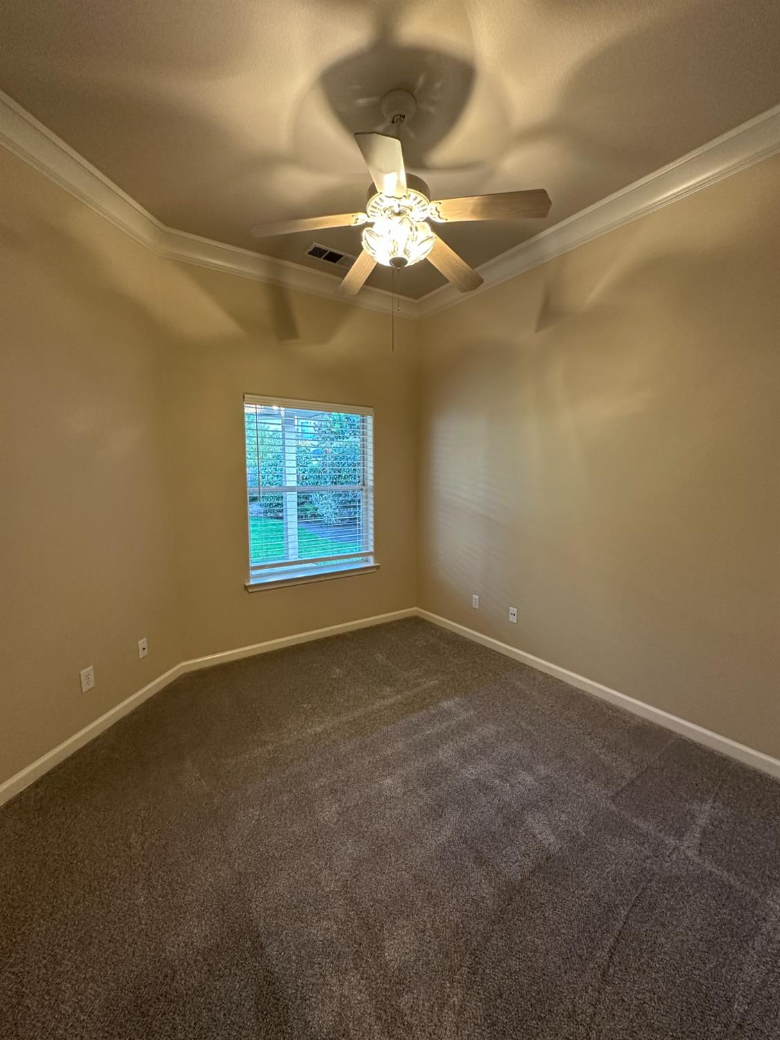 535 West Decatur Avenue Clovis, CA 93611 - Photo 19 of 51 an empty room with a ceiling fan and window