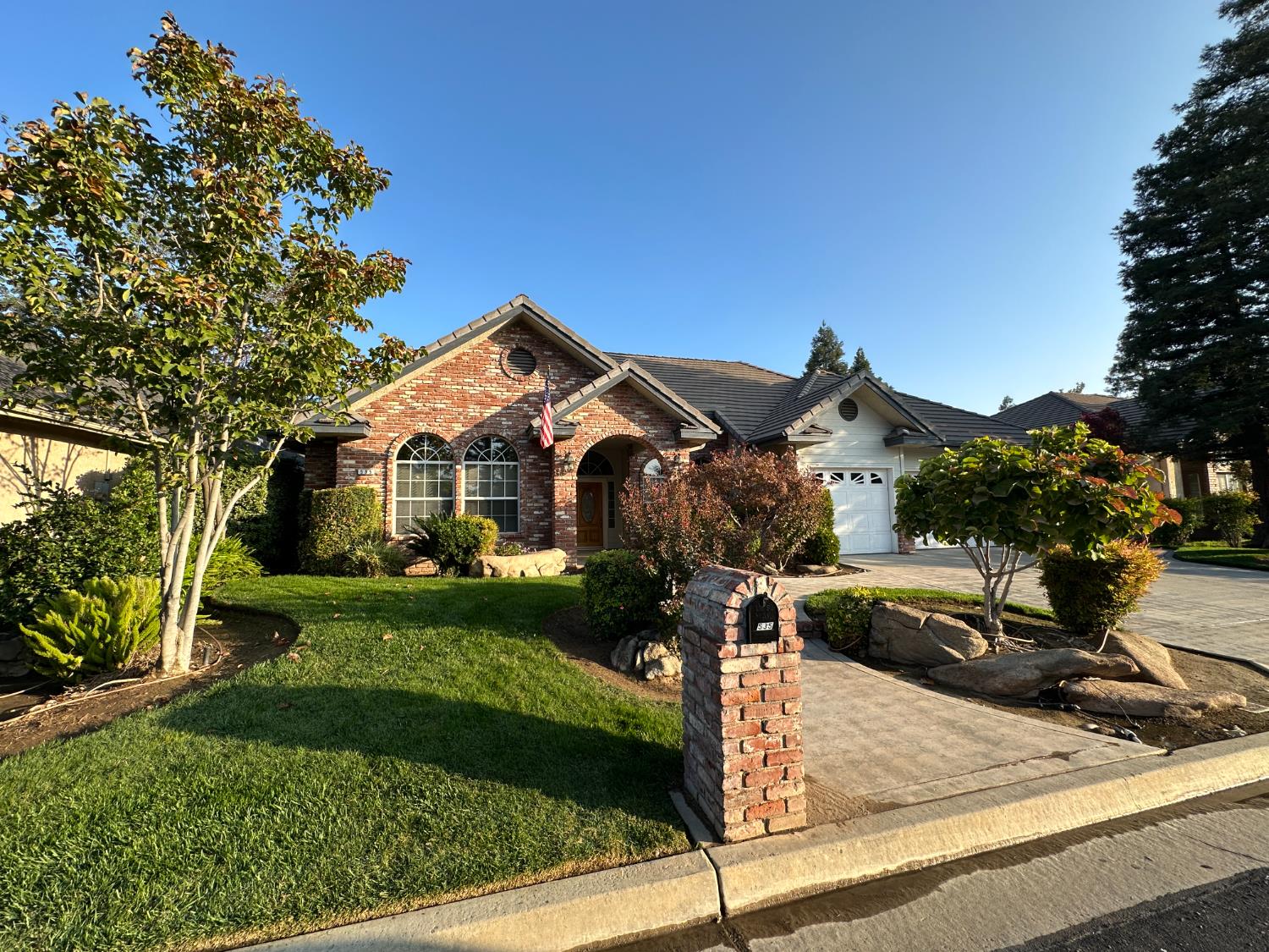 535 West Decatur Avenue Clovis, CA 93611 - Photo 2 of 51 a front view of a house with a yard