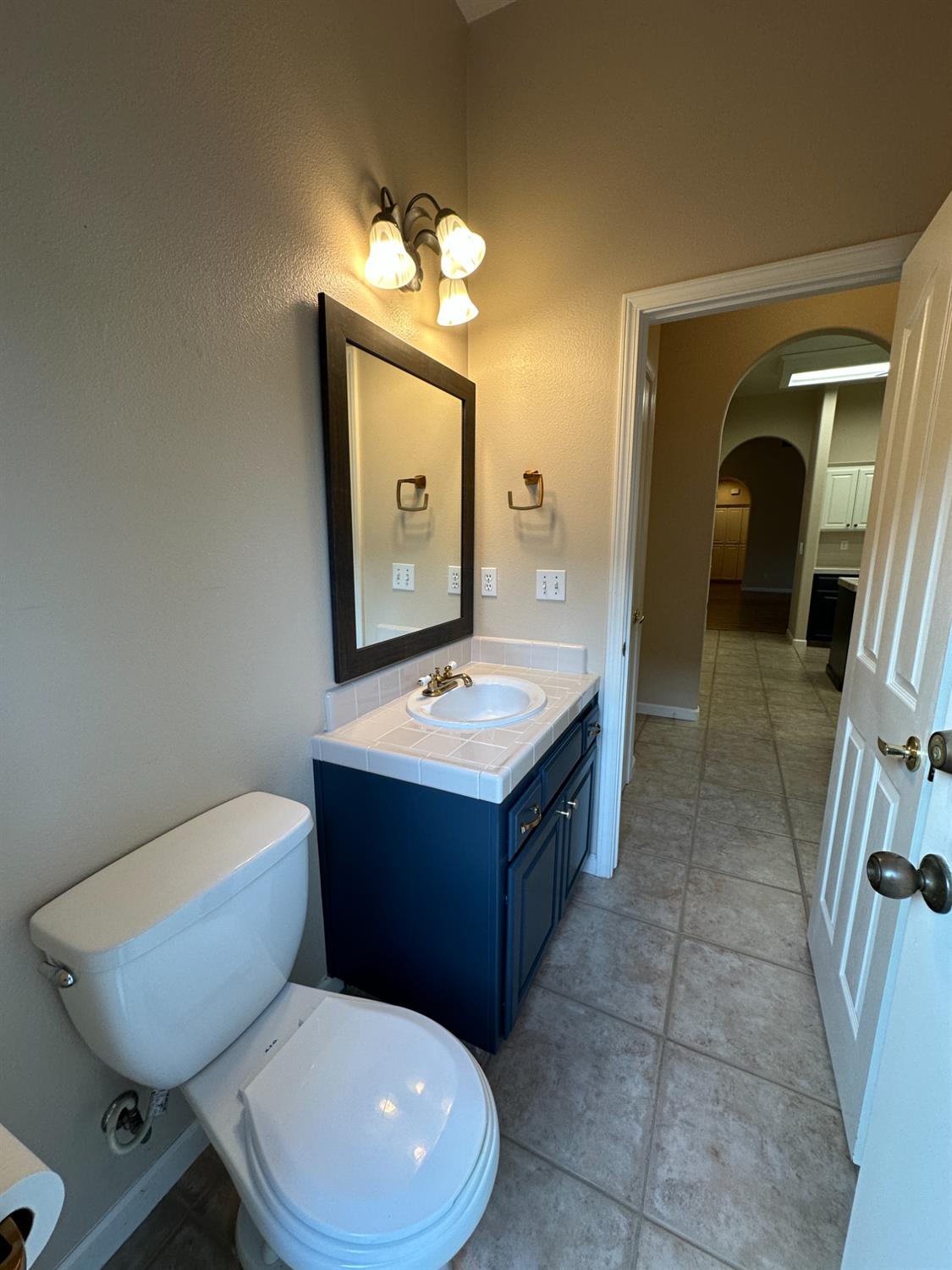 535 West Decatur Avenue Clovis, CA 93611 - Photo 22 of 51 a bathroom with a toilet sink and mirror