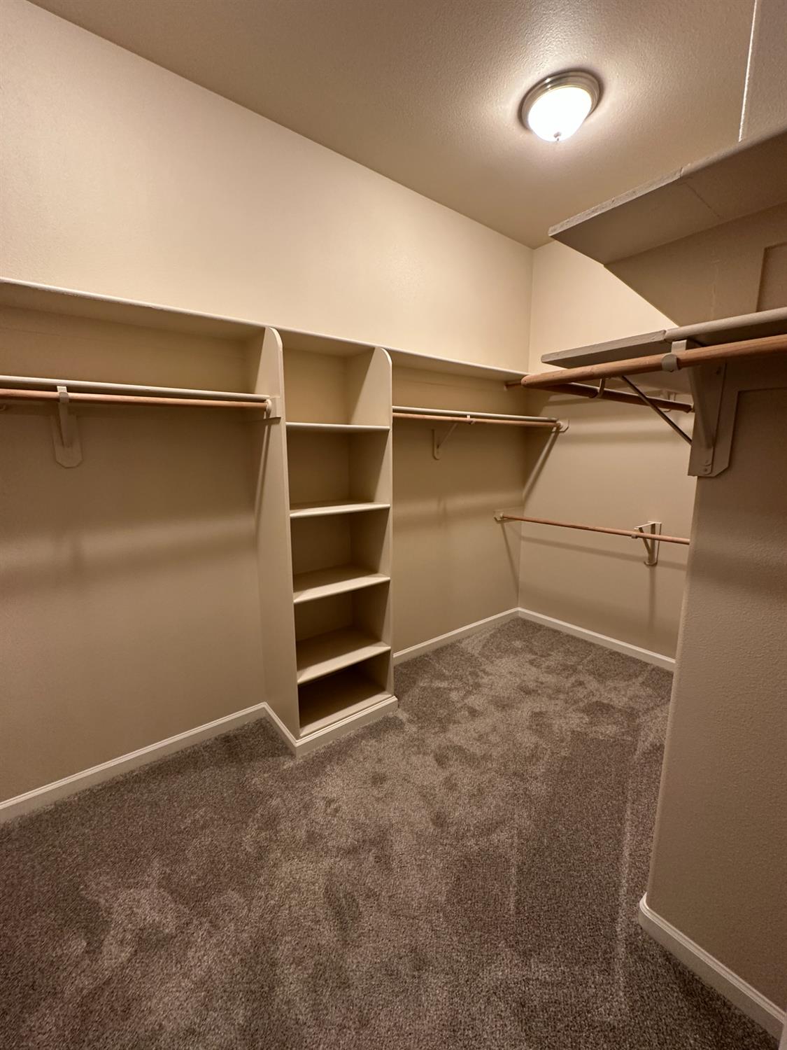 535 West Decatur Avenue Clovis, CA 93611 - Photo 33 of 51 a view of walk in closet with empty racks