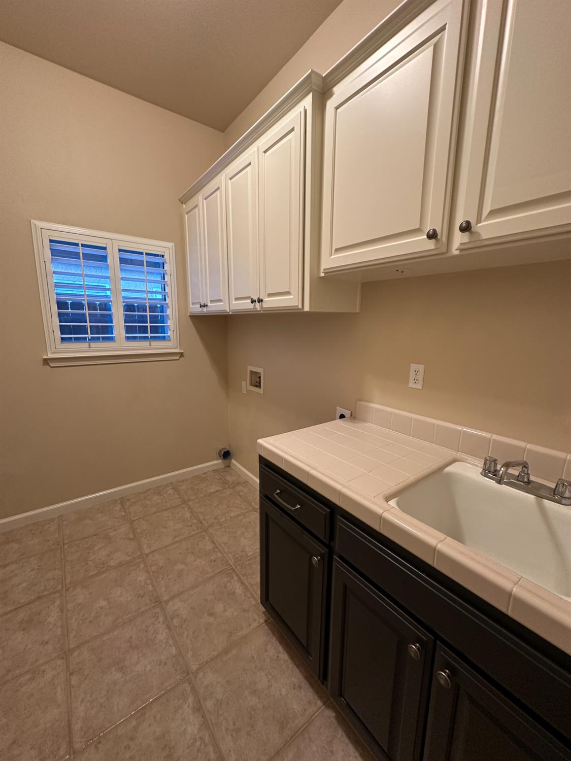 535 West Decatur Avenue Clovis, CA 93611 - Photo 39 of 51 a utility room with granite countertop cabinets washer and dryer