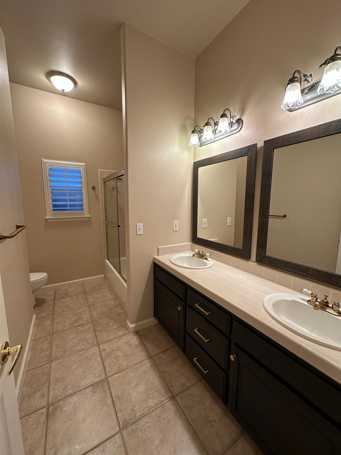 535 West Decatur Avenue Clovis, CA 93611 - Photo 41 of 51 a spacious bathroom with a double vanity sink and a mirror