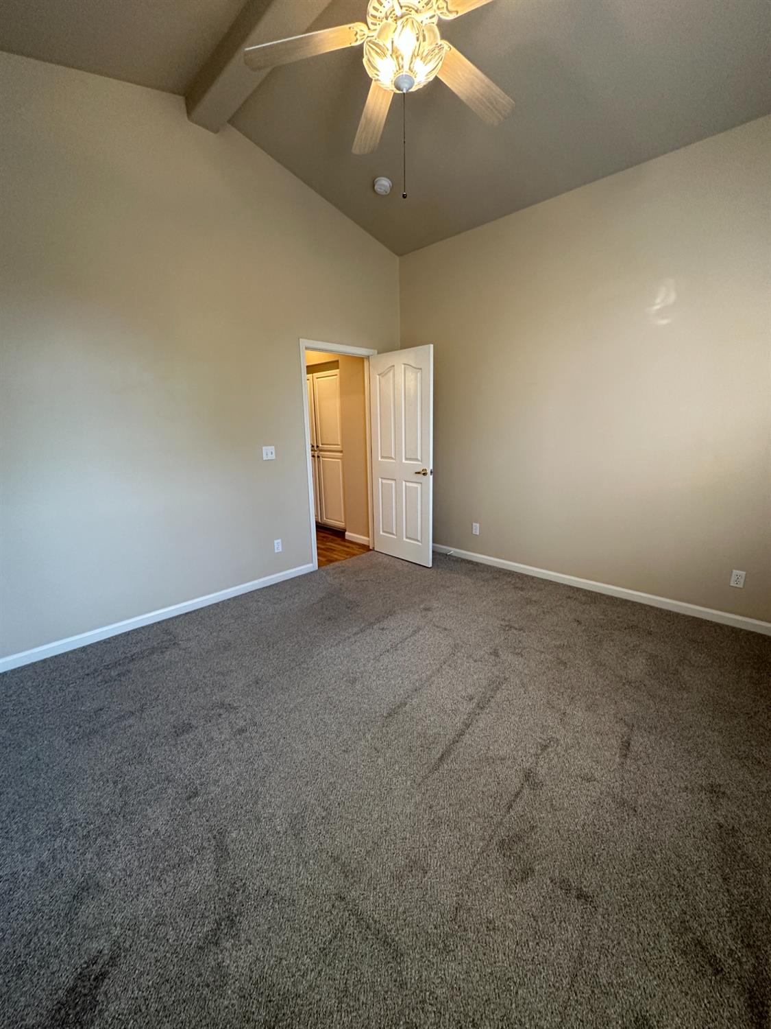 535 West Decatur Avenue Clovis, CA 93611 - Photo 44 of 51 an empty room with a chandelier fan and windows