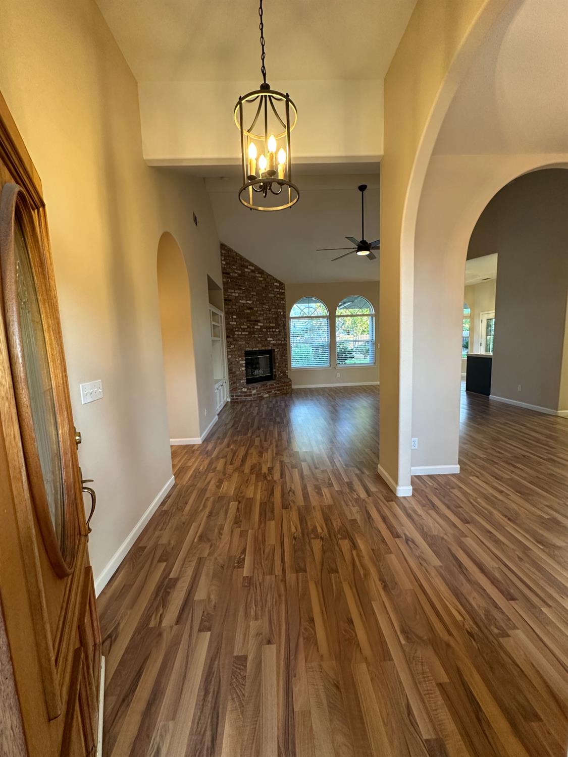 535 West Decatur Avenue Clovis, CA 93611 - Photo 6 of 51 a view of empty room with wooden floor and fireplace