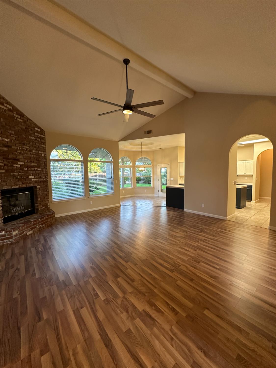 535 West Decatur Avenue Clovis, CA 93611 - Photo 7 of 51 an empty room with wooden floor chandelier and windows