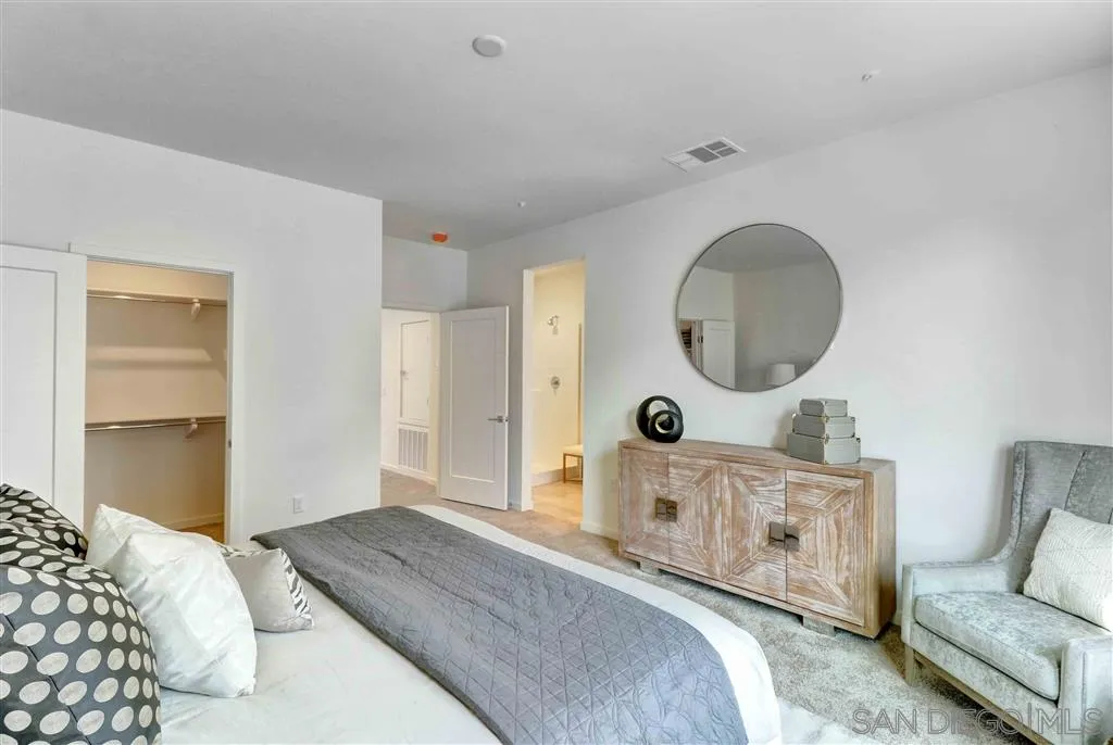 4007 Mission Inn Avenue Riverside, CA 92501 - Photo 16 of 25 a bedroom with a bed a mirror and dresser
