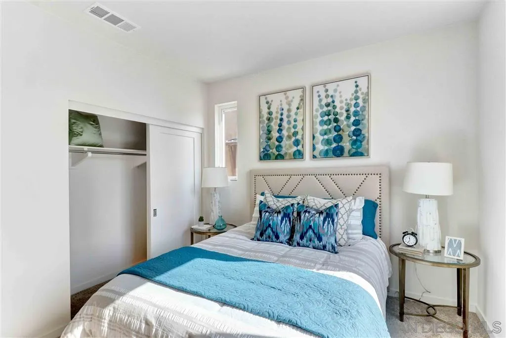4007 Mission Inn Avenue Riverside, CA 92501 - Photo 19 of 25 a bedroom with a bed and a window