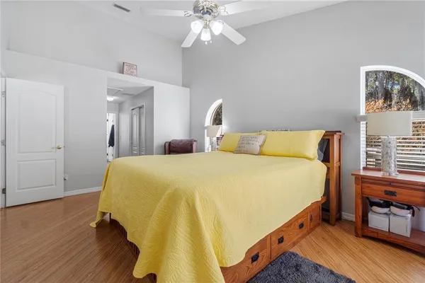 a kitchen with stainless steel appliances granite countertop a sink a counter space and wooden floor