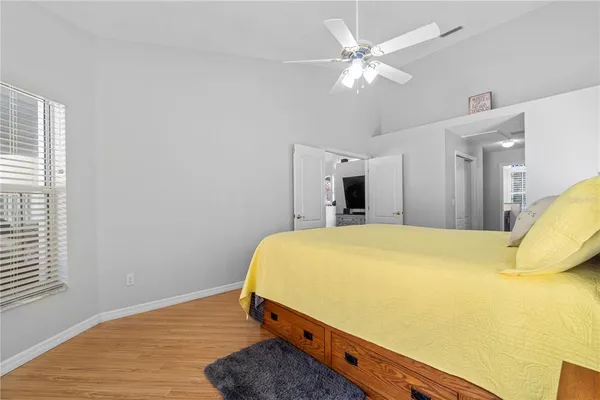 a kitchen with stainless steel appliances kitchen island granite countertop a table chairs and a refrigerator