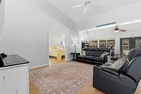 a view of pool with outdoor seating and city view