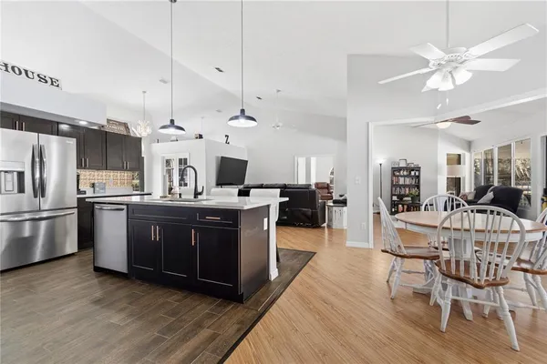 a bathroom with a tub sink a mirror and shower
