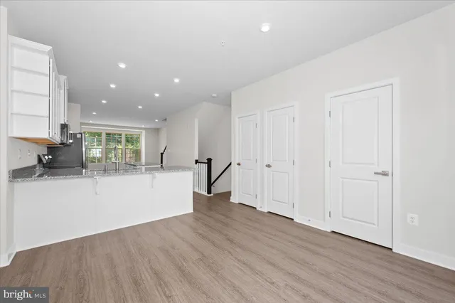 a view of a balcony with wooden floor