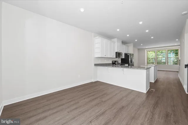a view of a deck with wooden floor and city view