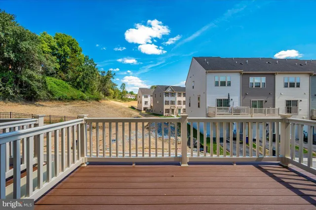 a view of a balcony with wooden floor