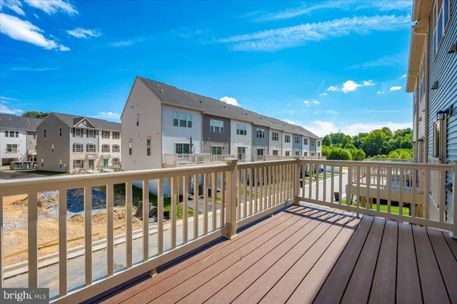 a view of a balcony with wooden floor