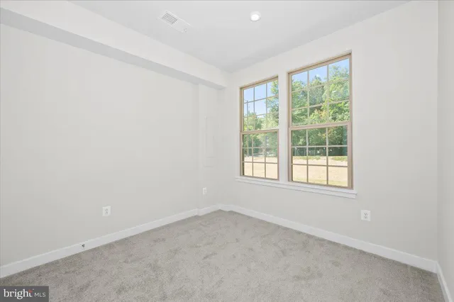 a front view of residential houses with yard