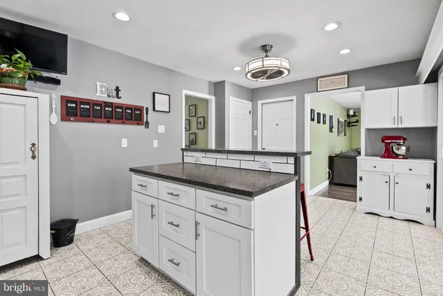 a kitchen with stainless steel appliances granite countertop a stove and a sink