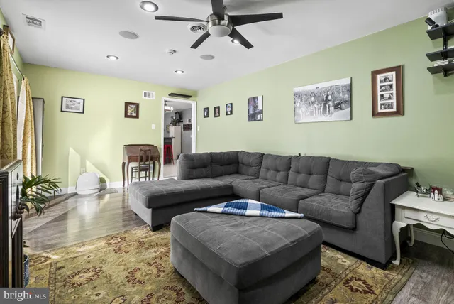 a living room with furniture and a rug