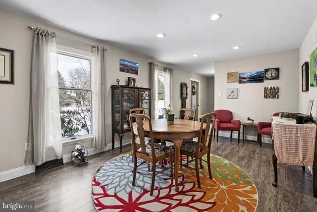 a view of a dining room with furniture and a window