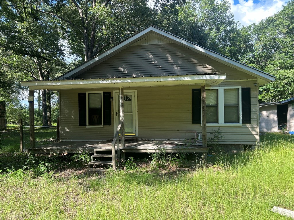 164 Parker Road Corrigan, TX 75939 - Photo 17 of 34 a front view of a house with a yard