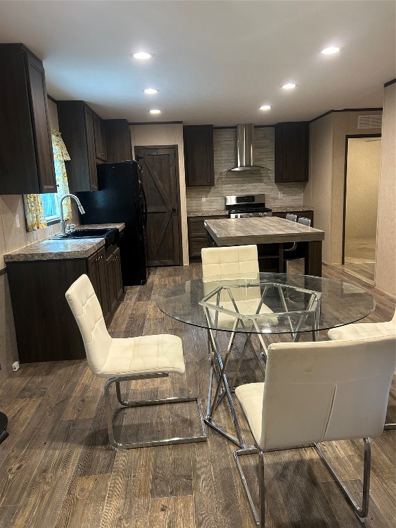 164 Parker Road Corrigan, TX 75939 - Photo 7 of 34 a kitchen with stainless steel appliances kitchen island granite countertop a sink a stove a microwave a refrigerator and cabinets