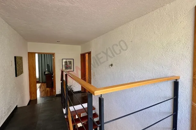 a view of entryway with stairs and wooden floor