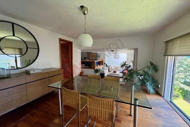 a view of a workspace room with furniture window and wooden floor