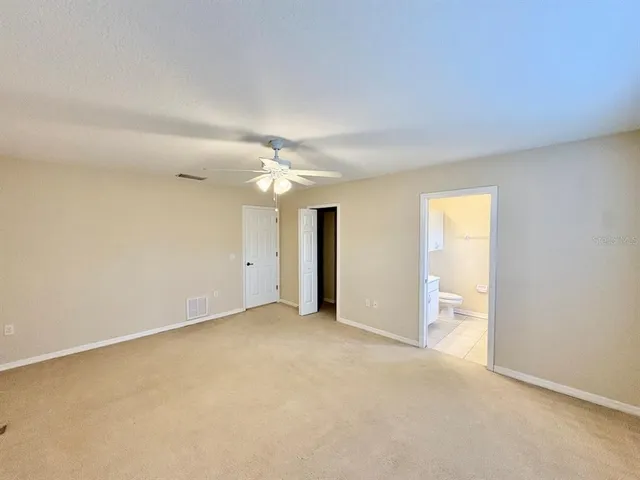 an empty room with a bathroom