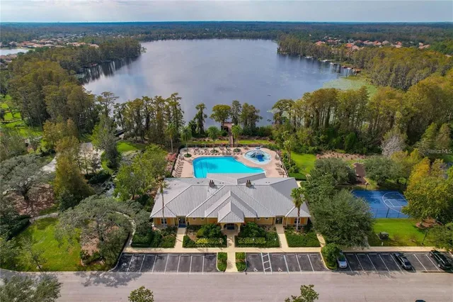 an aerial view of house with yard swimming pool and outdoor seating