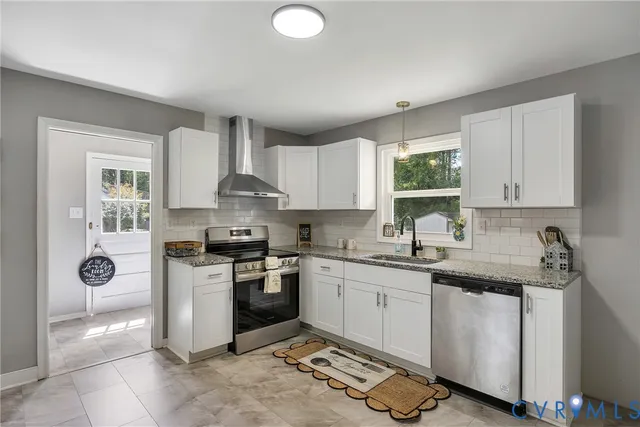 a kitchen with a sink stove and cabinets