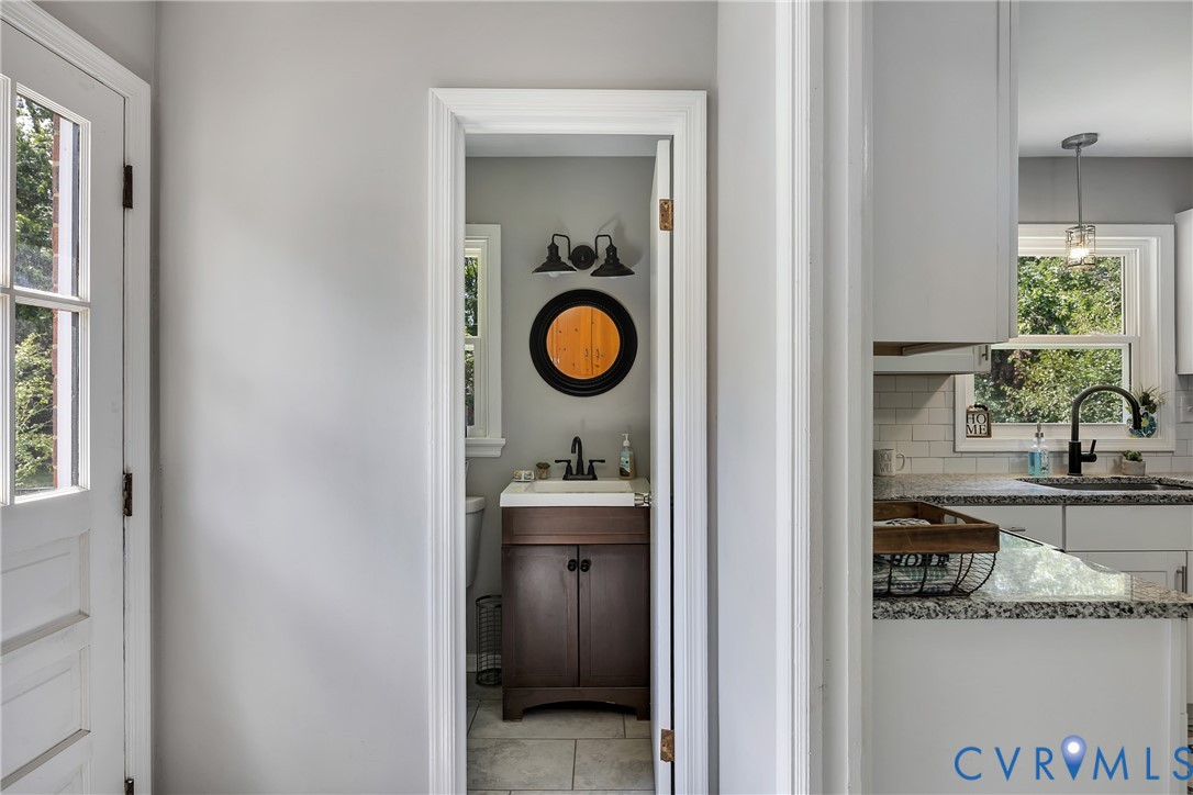 5702 West Rois Road Richmond, VA 23227 - Photo 17 of 22 a view of living room and front door