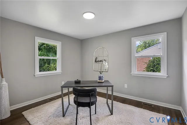 a workspace with furniture and a window