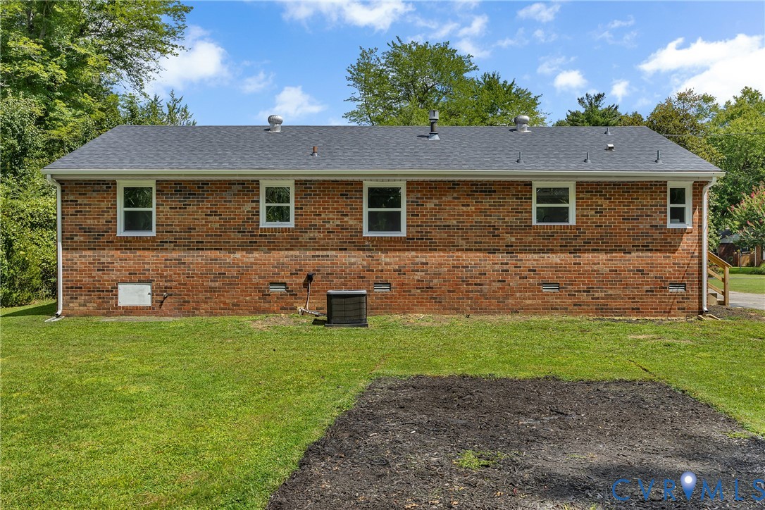 5702 West Rois Road Richmond, VA 23227 - Photo 21 of 22 a front view of a house with a yard