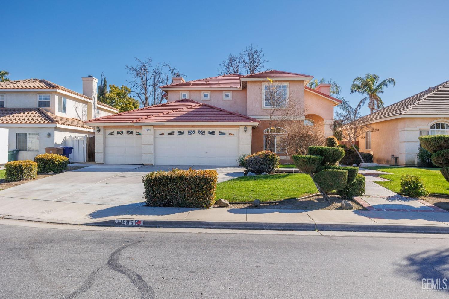 Undisclosed Address Bakersfield, CA 93311 - Photo 1 of 52 front view of a house with a garden