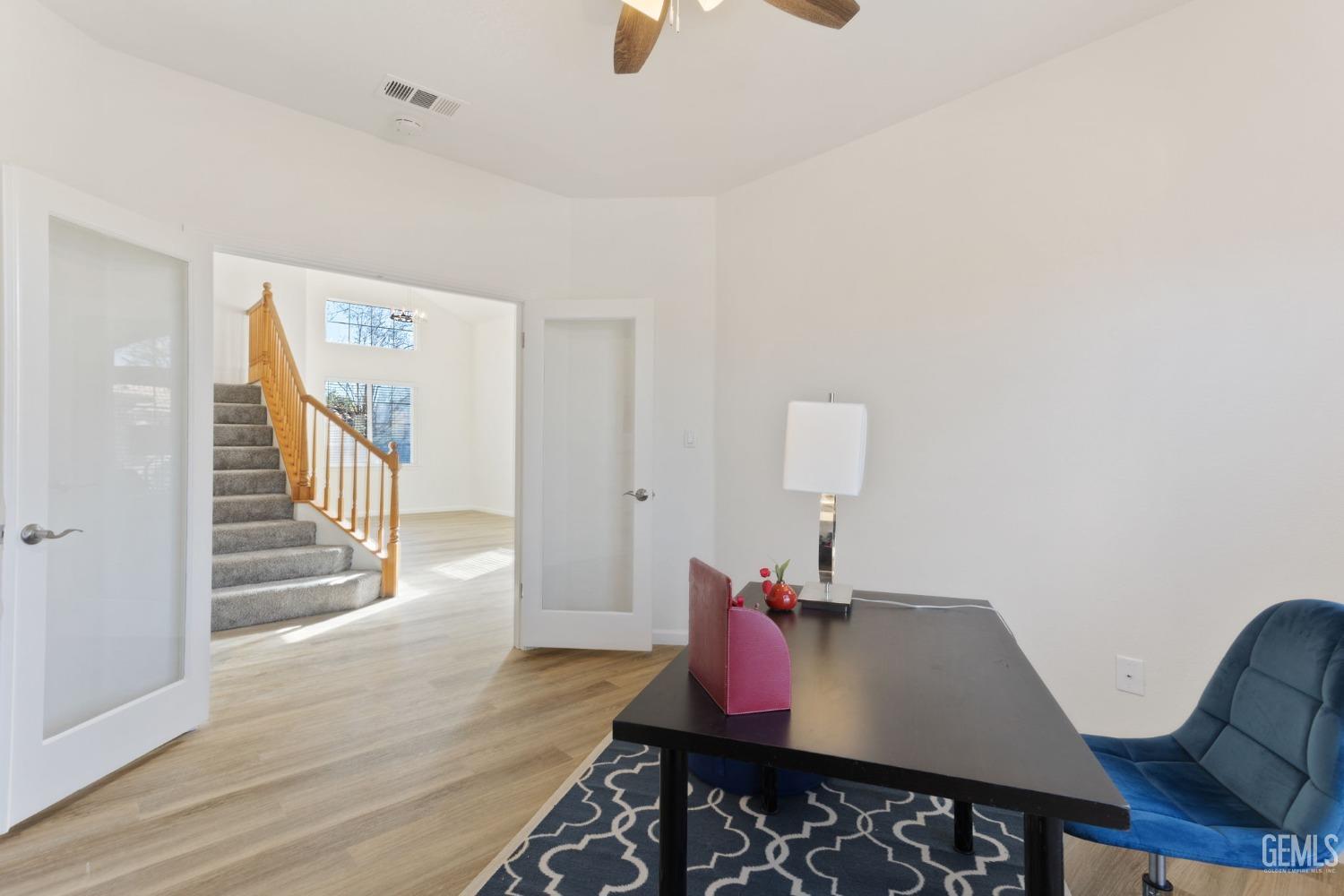 Undisclosed Address Bakersfield, CA 93311 - Photo 16 of 52 a view of a dining room with furniture and wooden floor