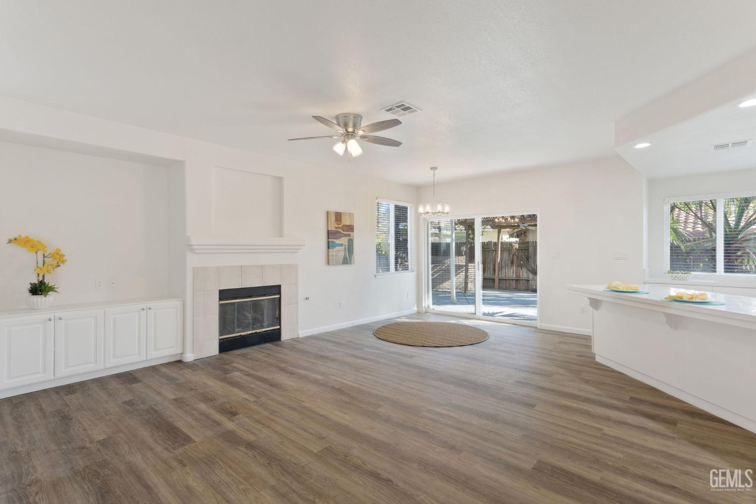 Undisclosed Address Bakersfield, CA 93311 - Photo 18 of 52 a view of livingroom with fireplace cabinet and windows