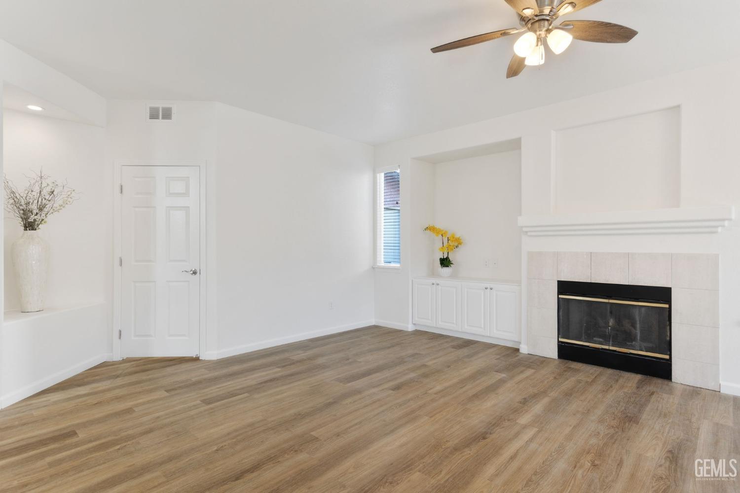 Undisclosed Address Bakersfield, CA 93311 - Photo 22 of 52 an empty room with fan and windows