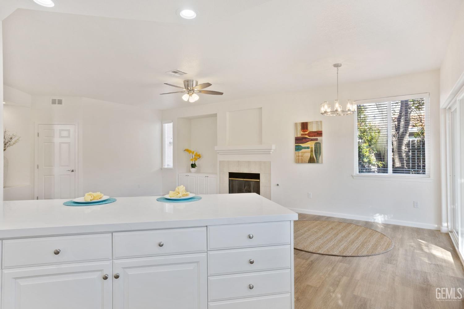 Undisclosed Address Bakersfield, CA 93311 - Photo 32 of 52 a kitchen with a cabinets and chandelier
