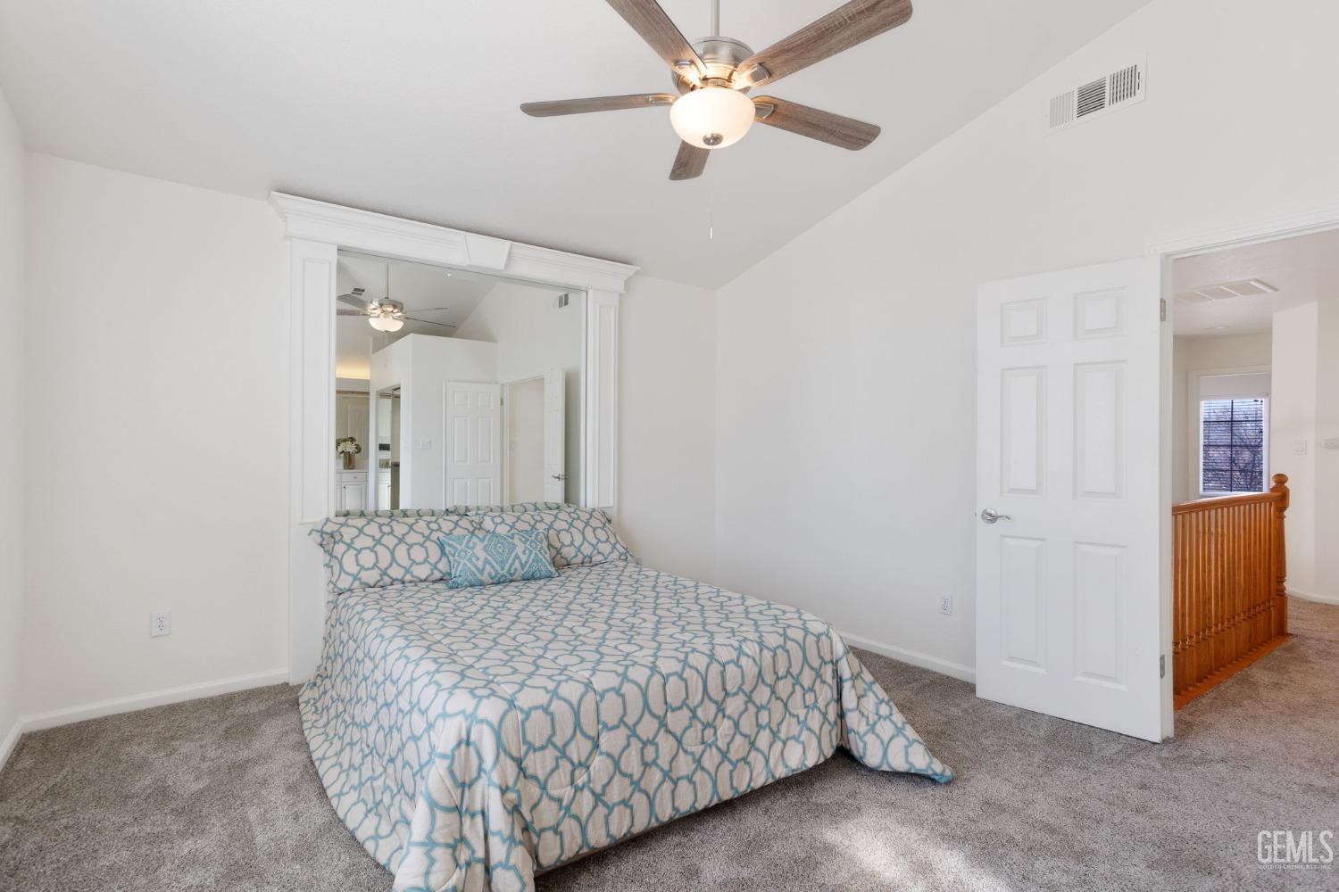 Undisclosed Address Bakersfield, CA 93311 - Photo 36 of 52 a bedroom with a bed and a ceiling fan