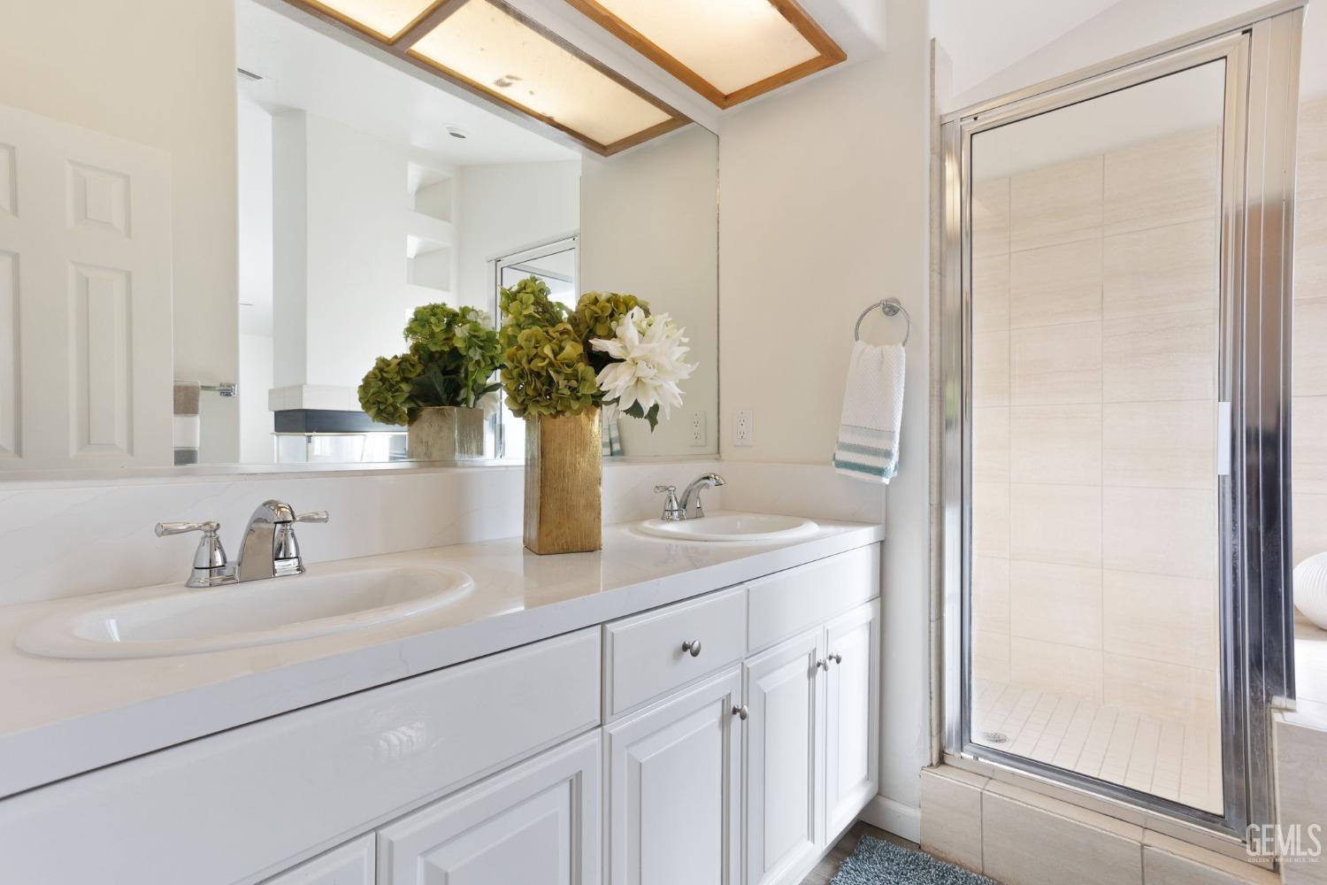 Undisclosed Address Bakersfield, CA 93311 - Photo 39 of 52 a bathroom with a sink and a mirror