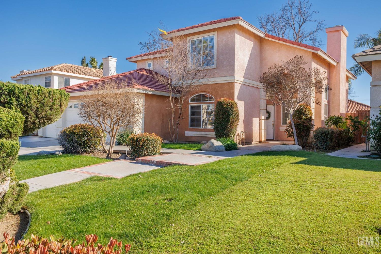 Undisclosed Address Bakersfield, CA 93311 - Photo 4 of 52 a front view of a house with a yard